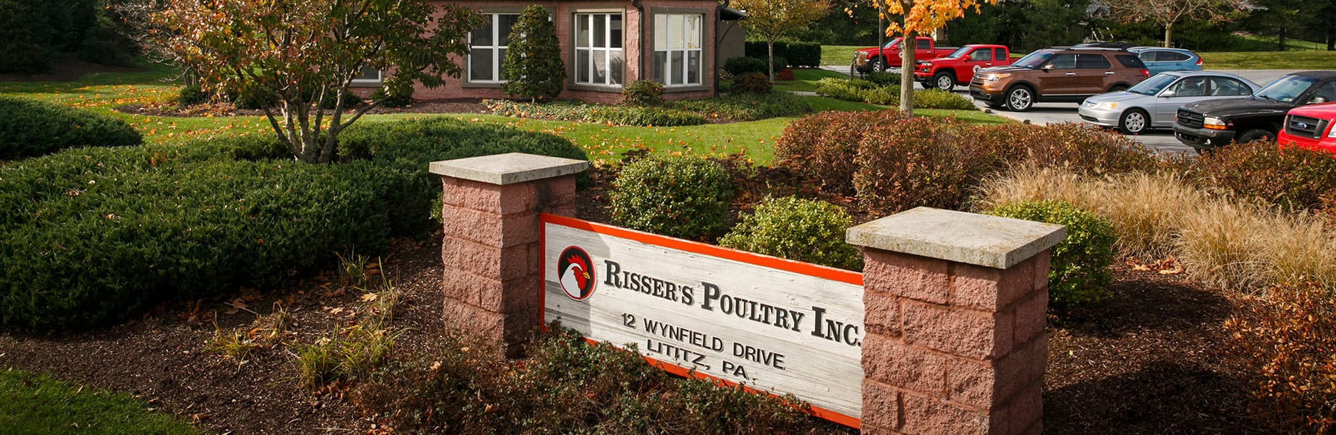 Office building with Rissers Poultry, Inc. sign in the foreground